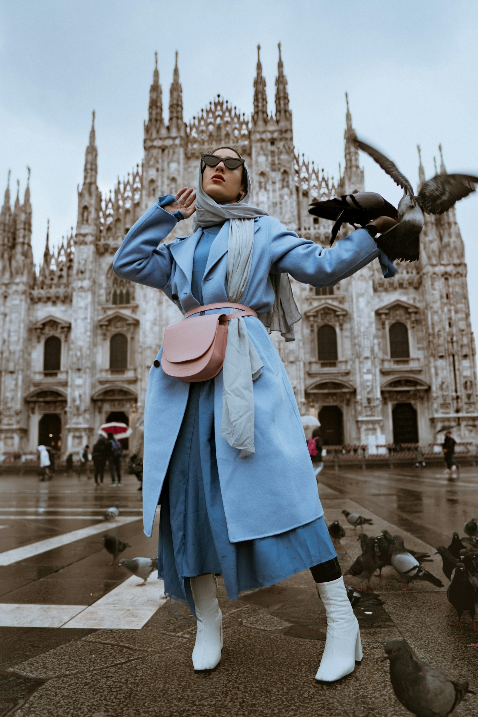 Autumn street style: a powder-blue coat and sculptural accessories in Milan